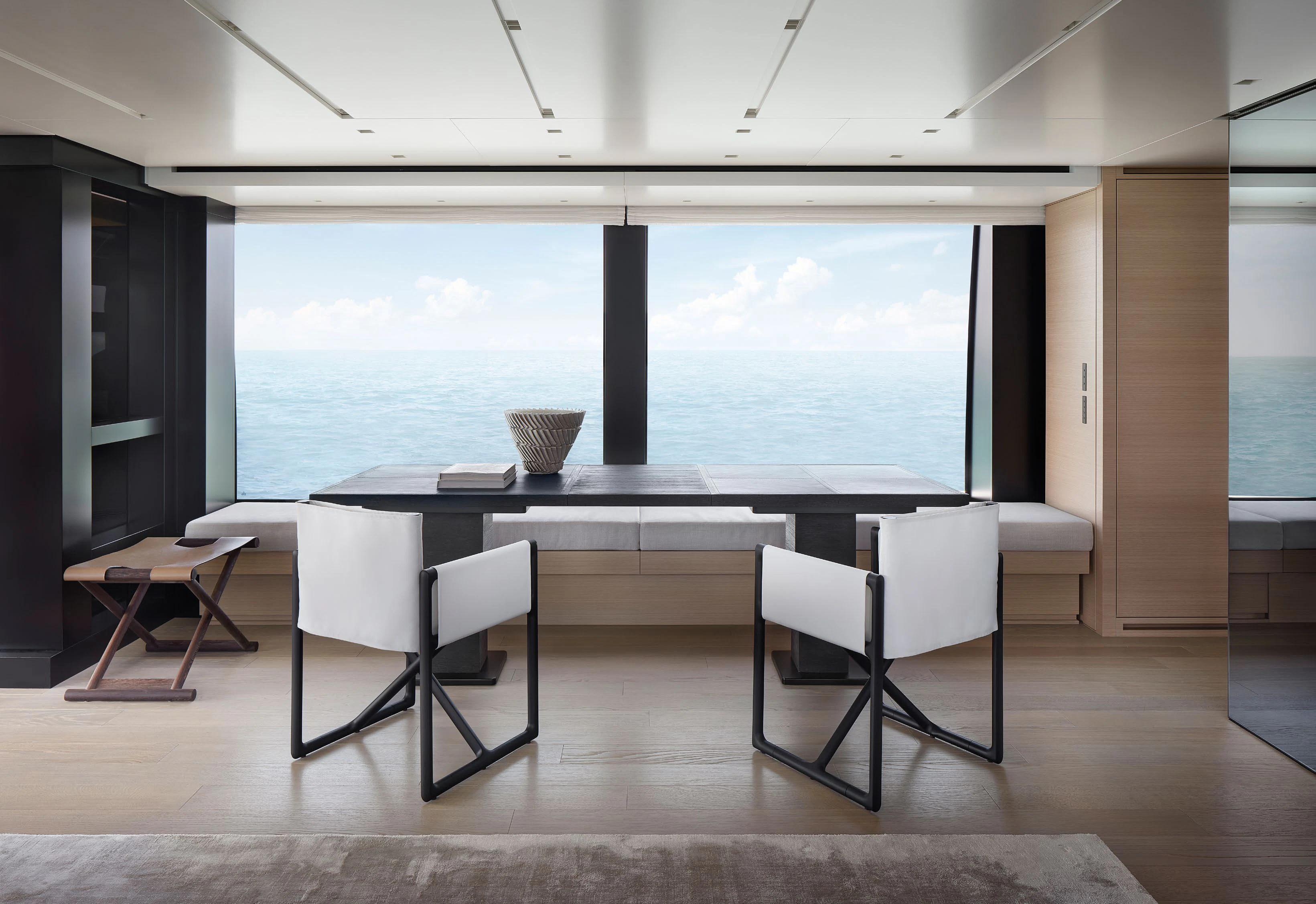 a room with a table and chairs aboard STRA DODO Yacht for Sale