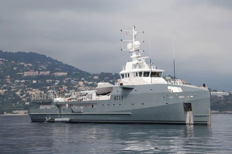 a large white ship aboard KALM Yacht for Sale