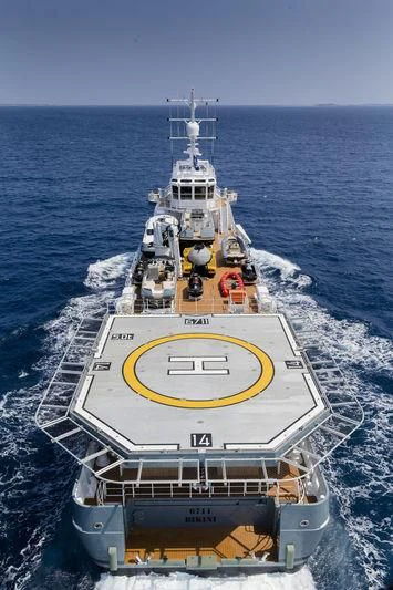 a large ship in the water aboard KALM Yacht for Sale