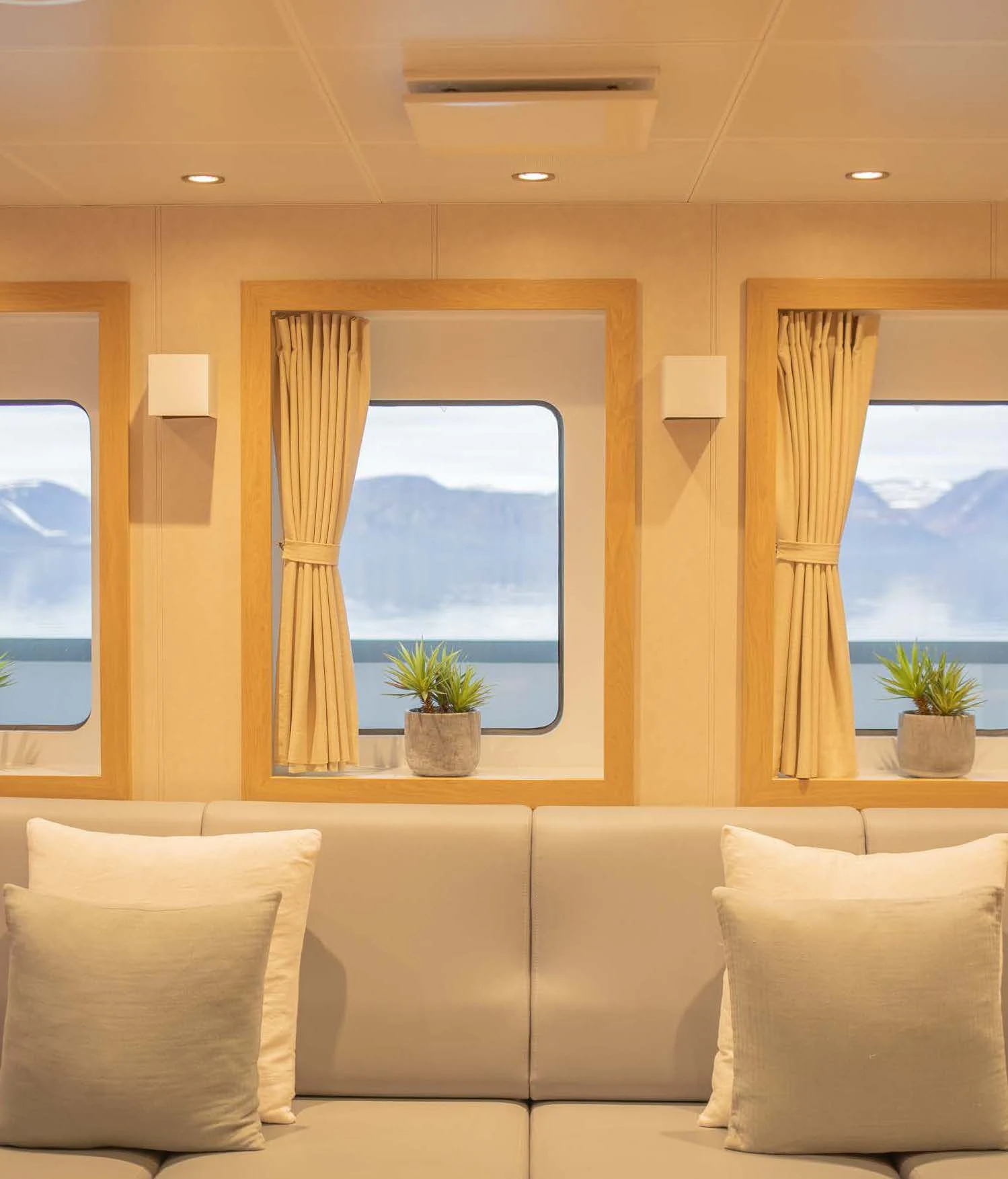 a living room with a large window aboard KALM Yacht for Sale