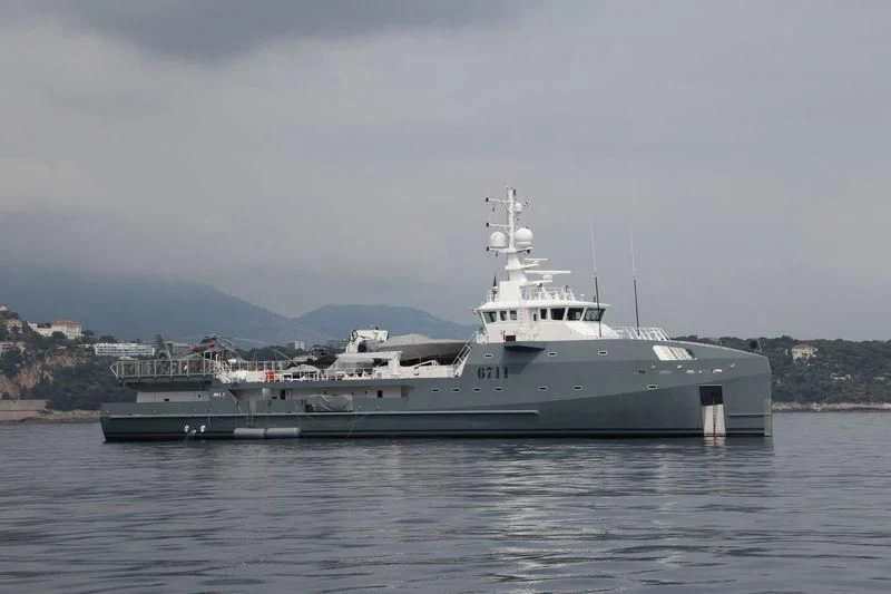 a large ship in the water aboard KALM Yacht for Sale