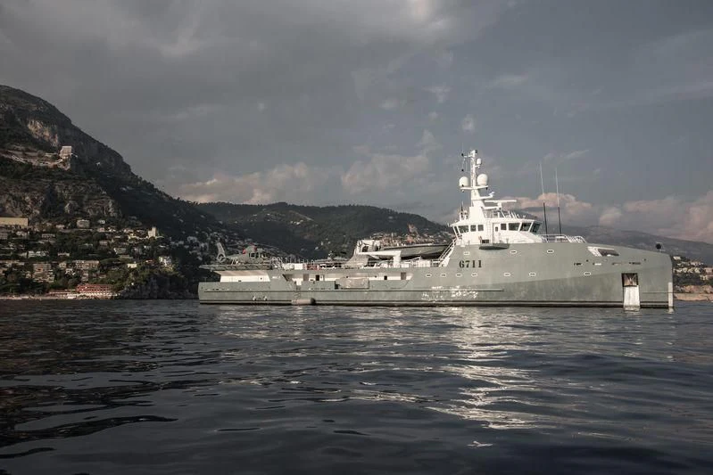 a large ship in the water aboard KALM Yacht for Sale
