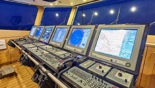 a room full of computers aboard KALM Yacht for Sale