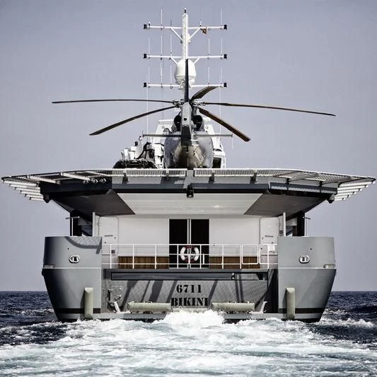 a large ship in the water aboard KALM Yacht for Sale