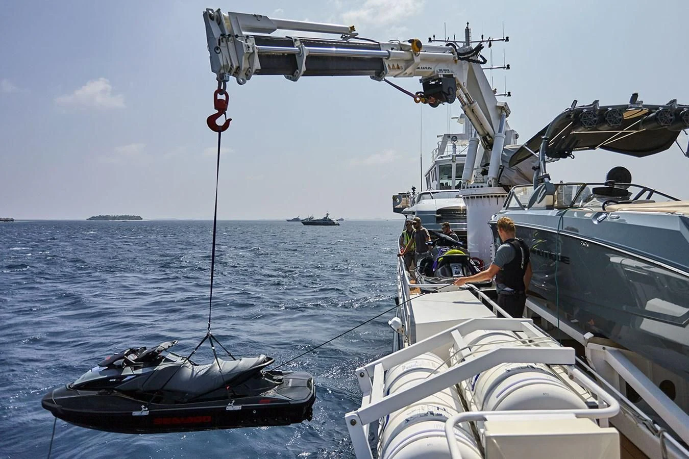 a group of people on a boat aboard KALM Yacht for Sale