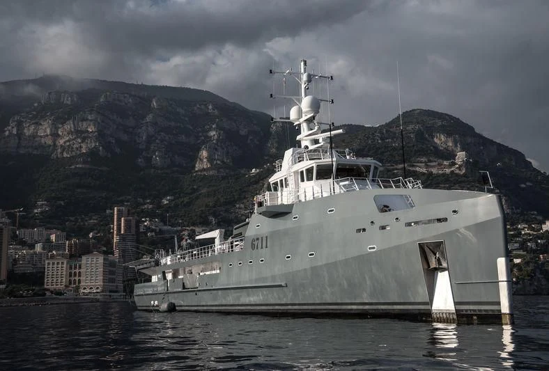 a large ship in the water aboard KALM Yacht for Sale