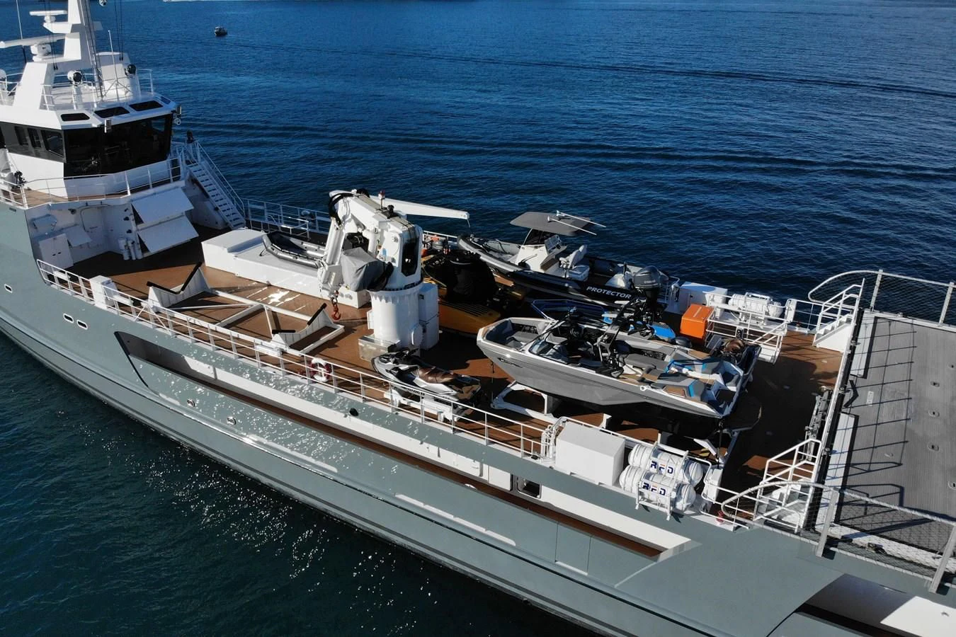 a large ship in the water aboard KALM Yacht for Sale
