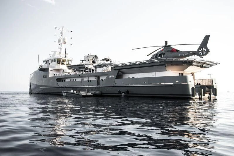 a large ship in the water aboard KALM Yacht for Sale