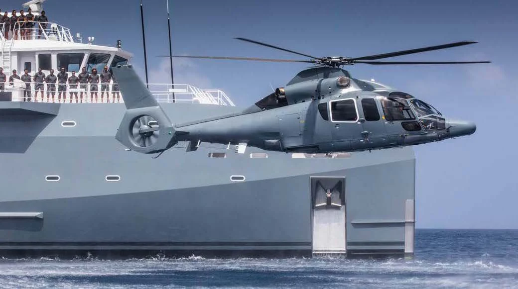a helicopter flying over a dock aboard KALM Yacht for Sale