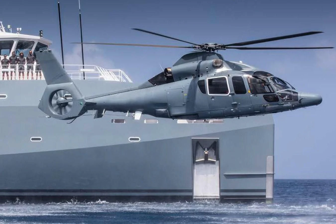 a helicopter flying over a boat aboard KALM Yacht for Sale