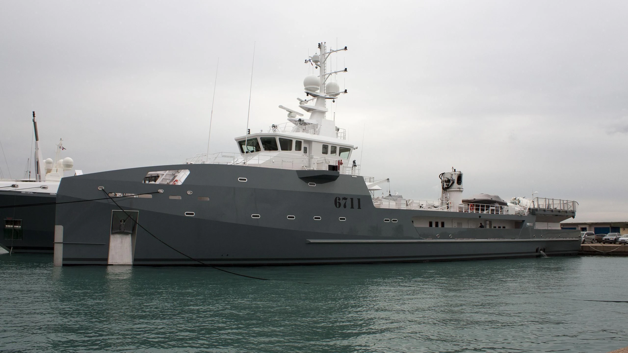 a large ship in the water aboard KALM Yacht for Sale