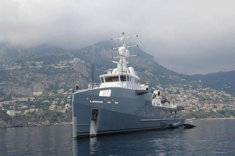 a large ship in the water aboard KALM Yacht for Sale