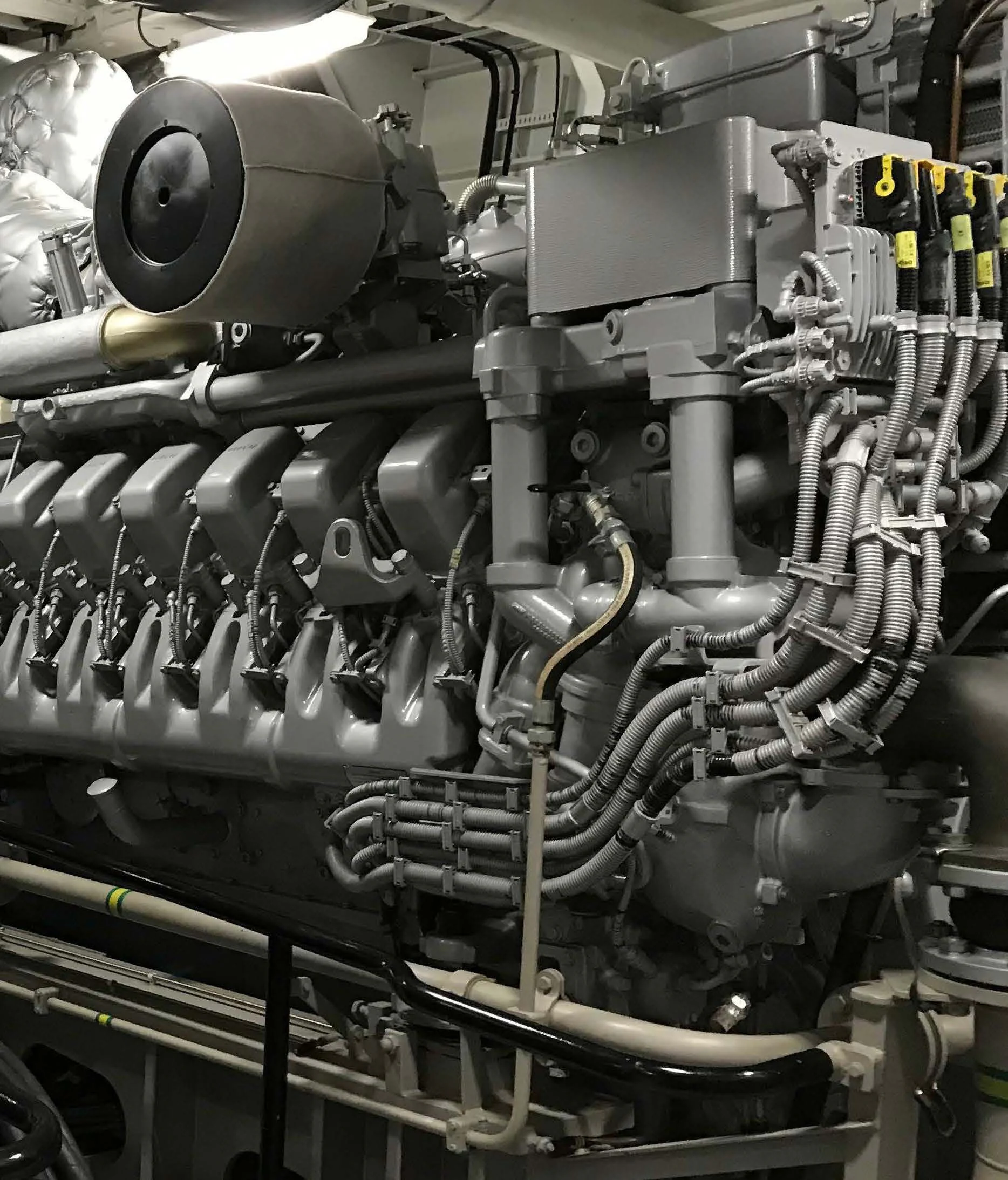 a machine with a large metal piece aboard KALM Yacht for Sale