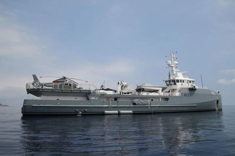 a large ship in the water aboard KALM Yacht for Sale