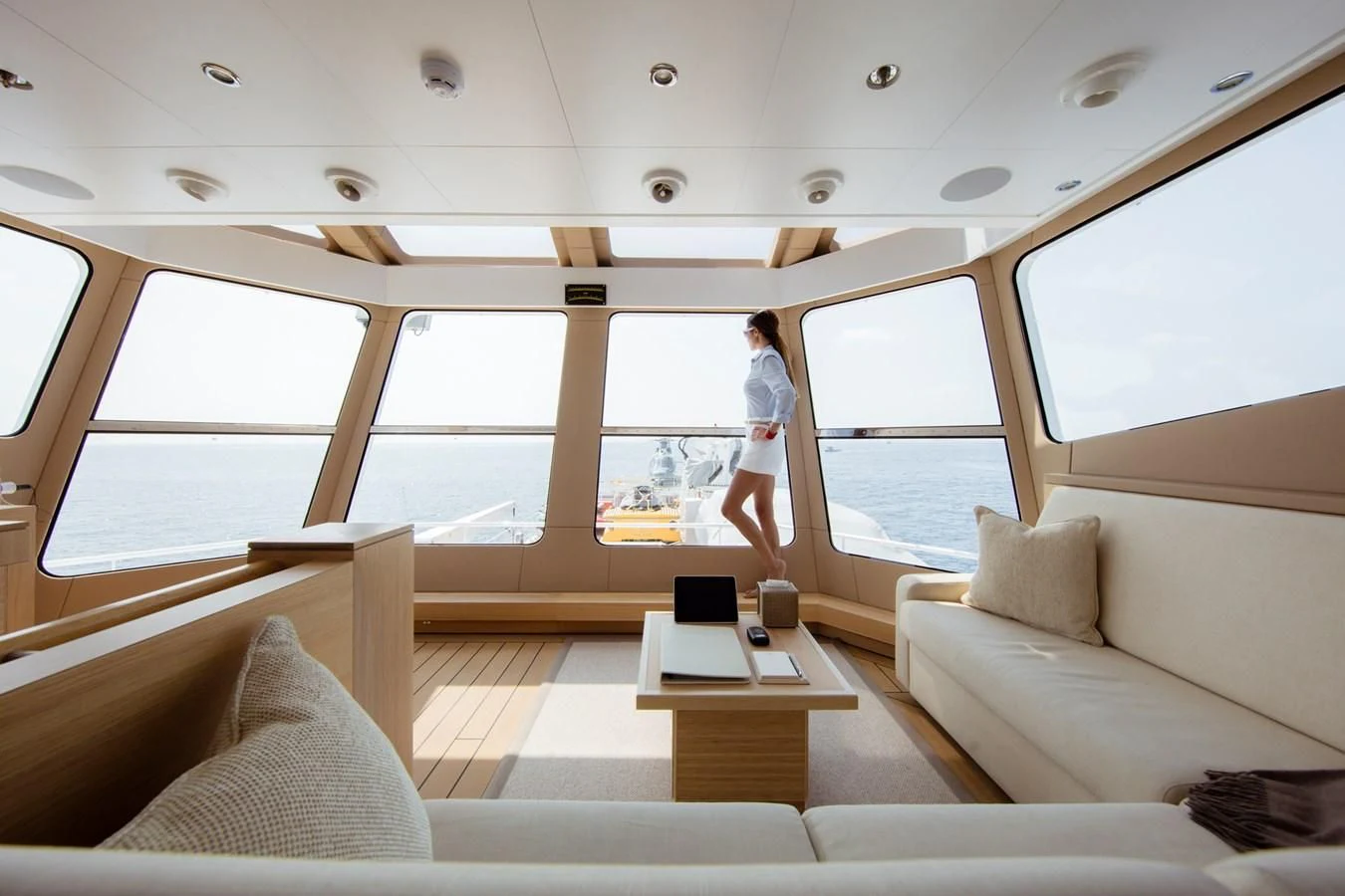 a person walking on a boat aboard KALM Yacht for Sale
