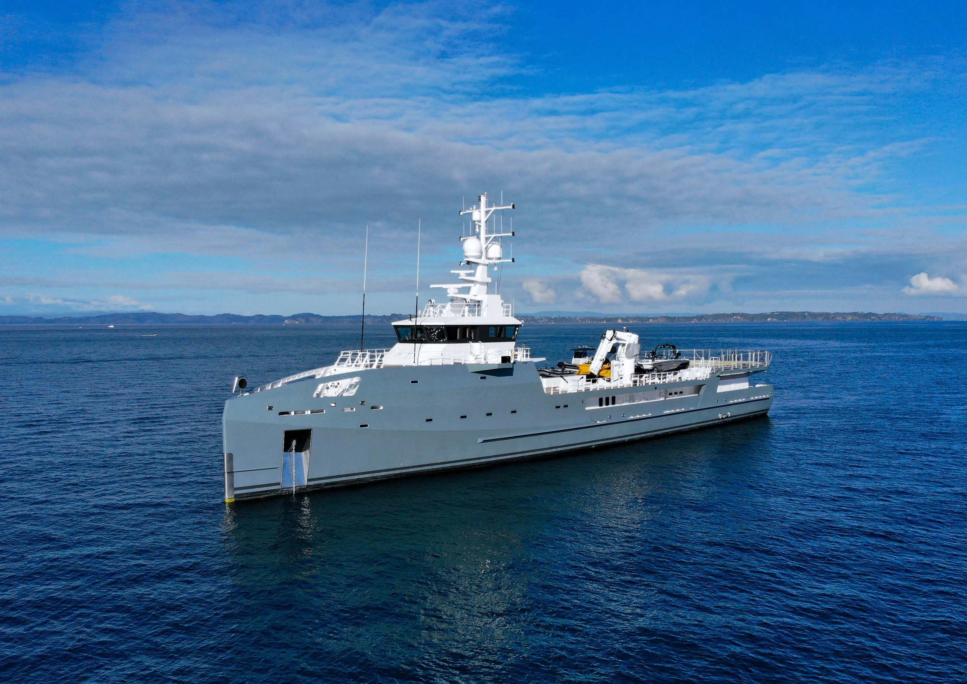a large white ship in the water aboard KALM Yacht for Sale