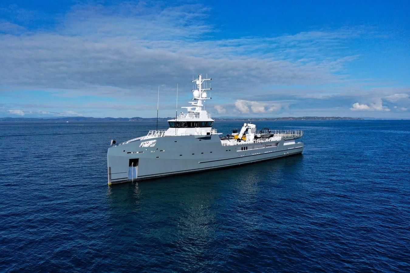 a large white ship in the water aboard KALM Yacht for Sale