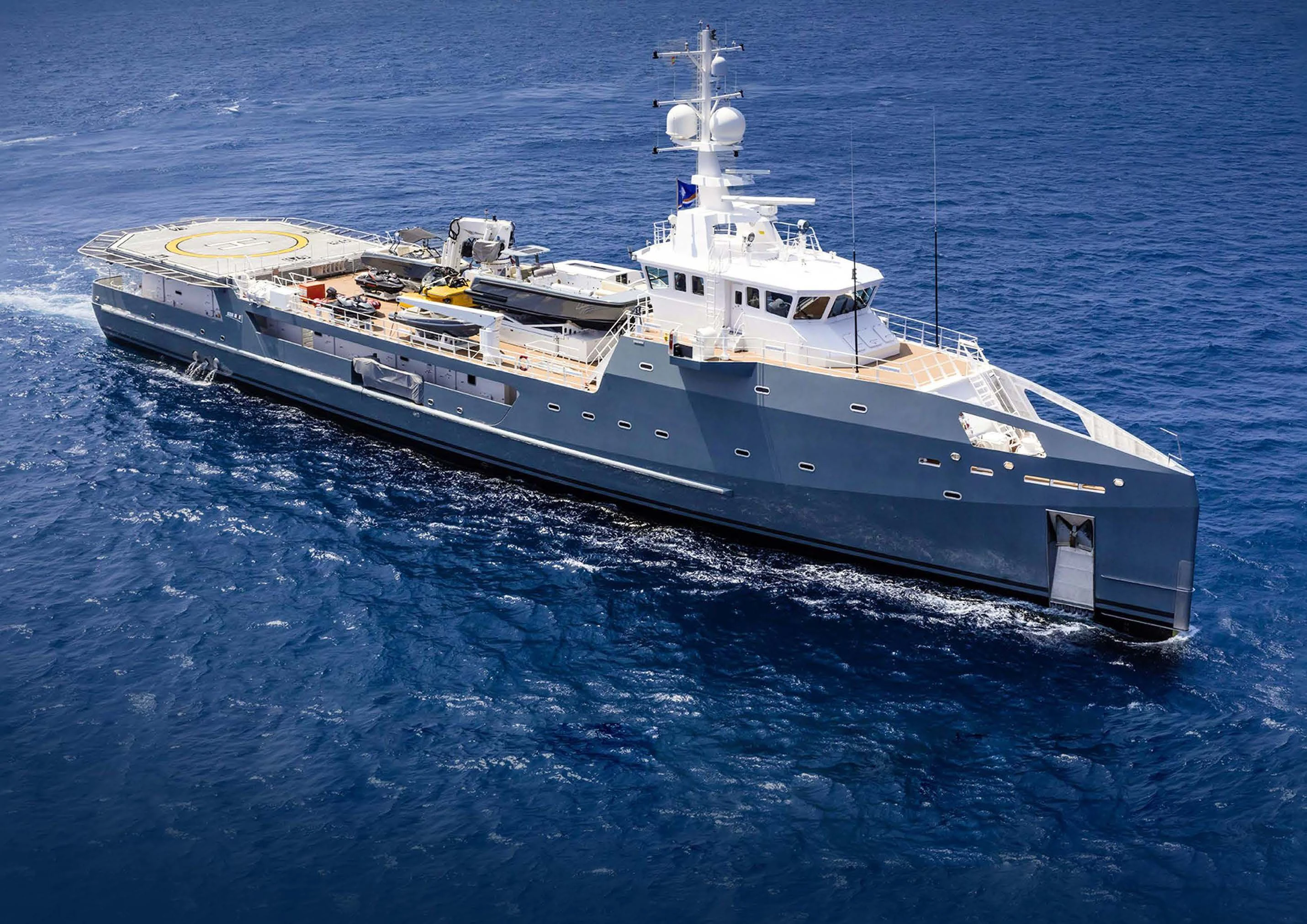 a large ship in the water aboard KALM Yacht for Sale