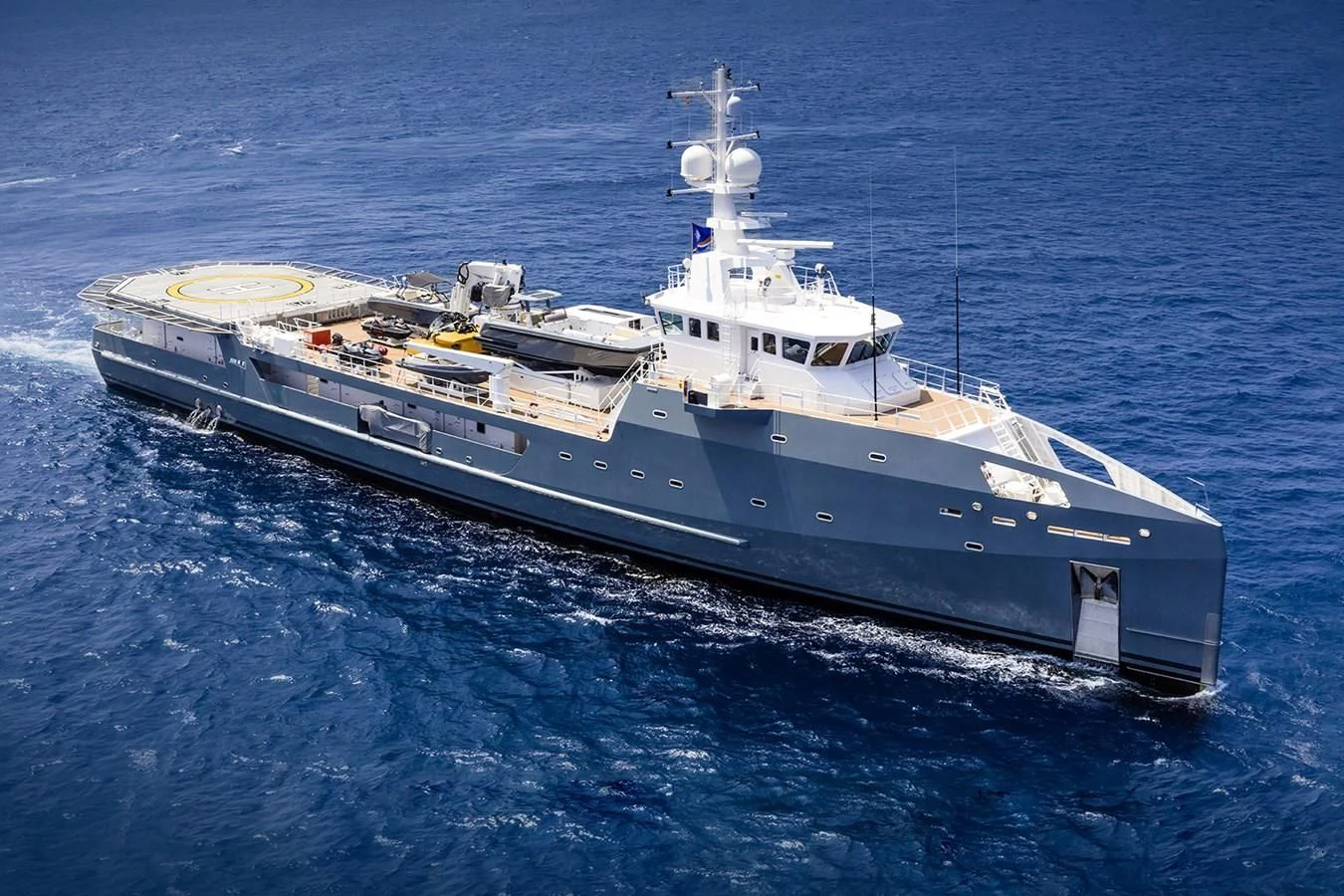 a large ship in the water aboard KALM Yacht for Sale