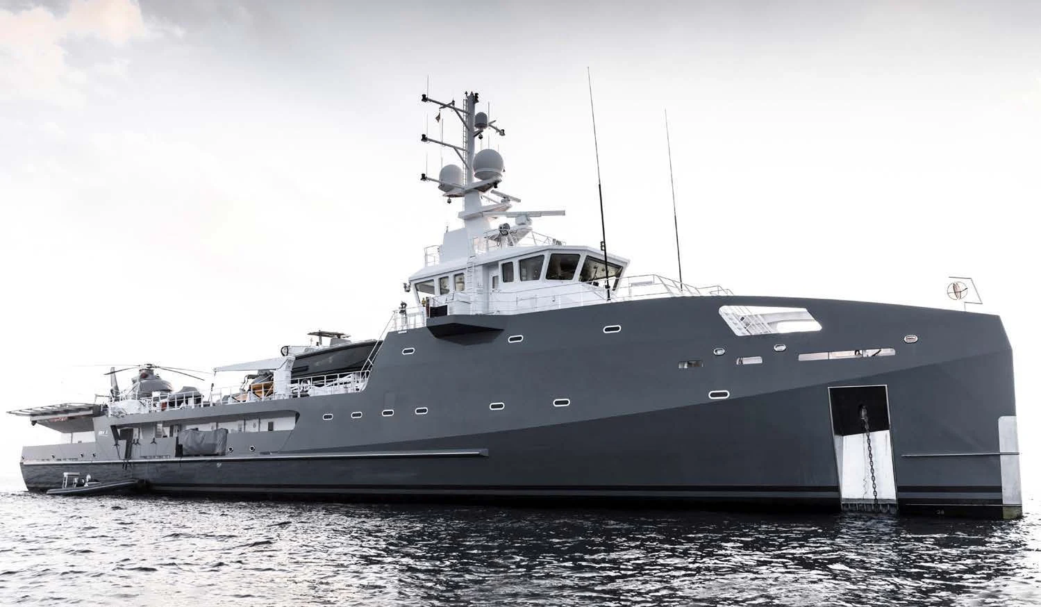 a large ship in the water aboard KALM Yacht for Sale