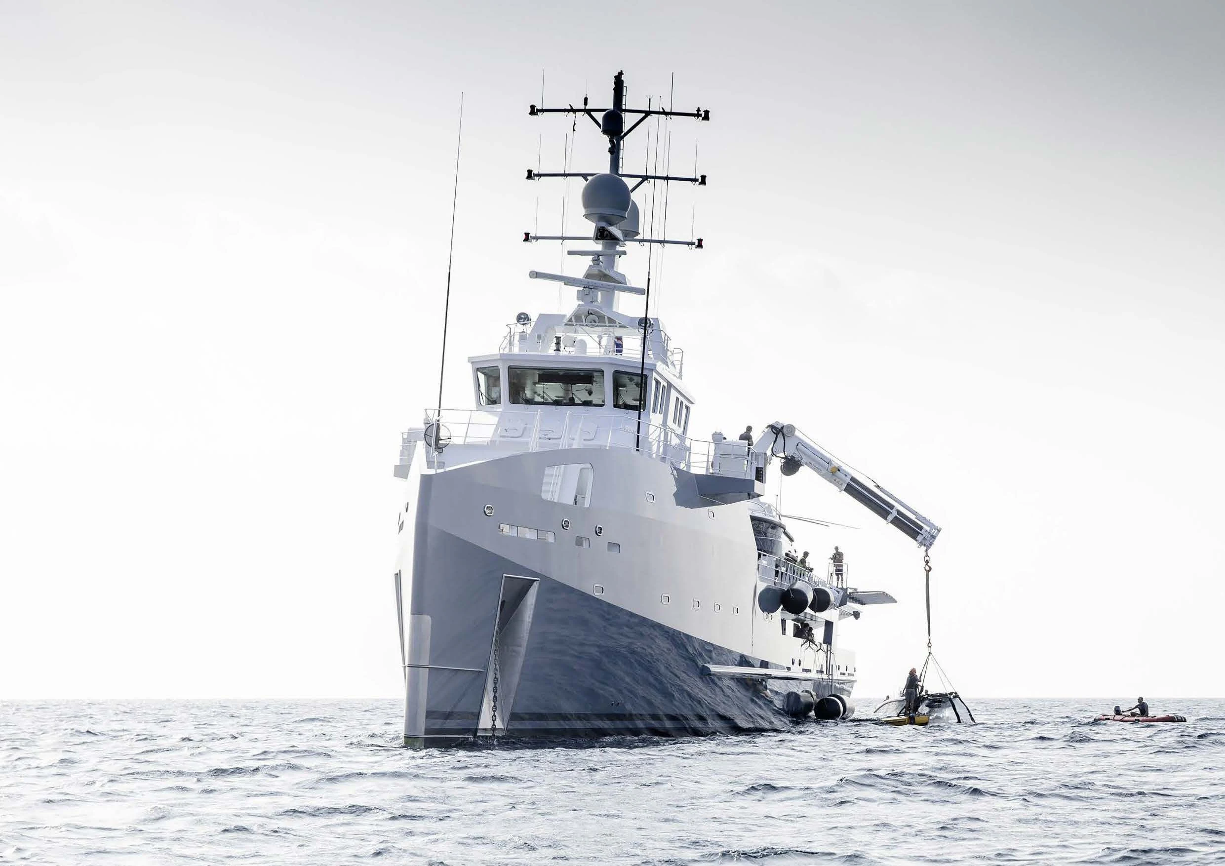 a large ship in the water aboard KALM Yacht for Sale