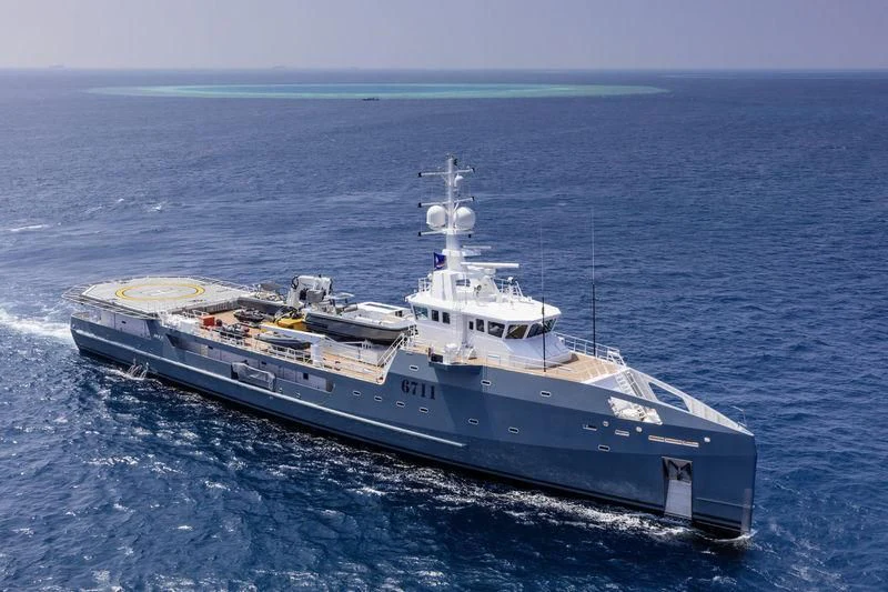a large ship in the water aboard KALM Yacht for Sale