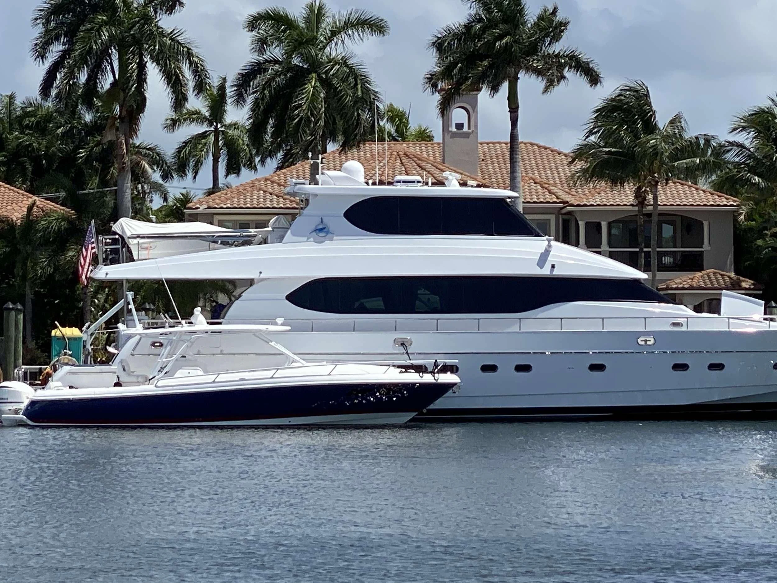 a large white yacht in the water aboard TORTUGA Yacht for Sale