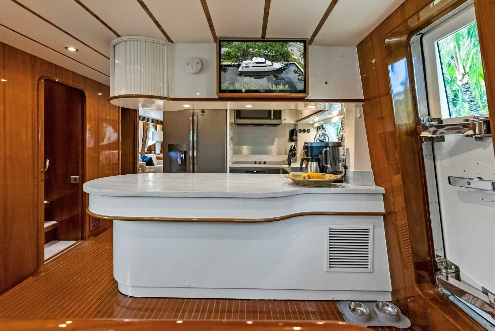 a kitchen with a large island aboard TORTUGA Yacht for Sale