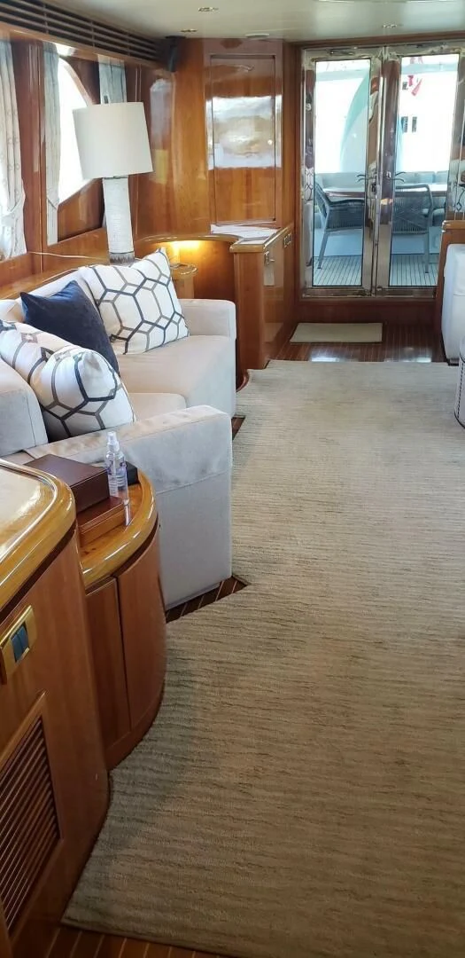 a living room with a couch and a table aboard TORTUGA Yacht for Sale