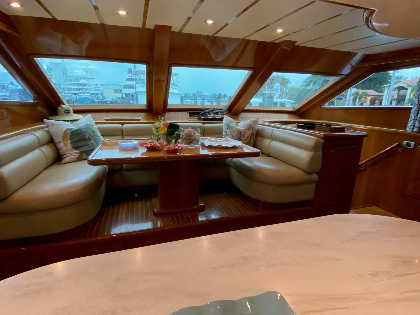 a room with a table and couches aboard TORTUGA Yacht for Sale