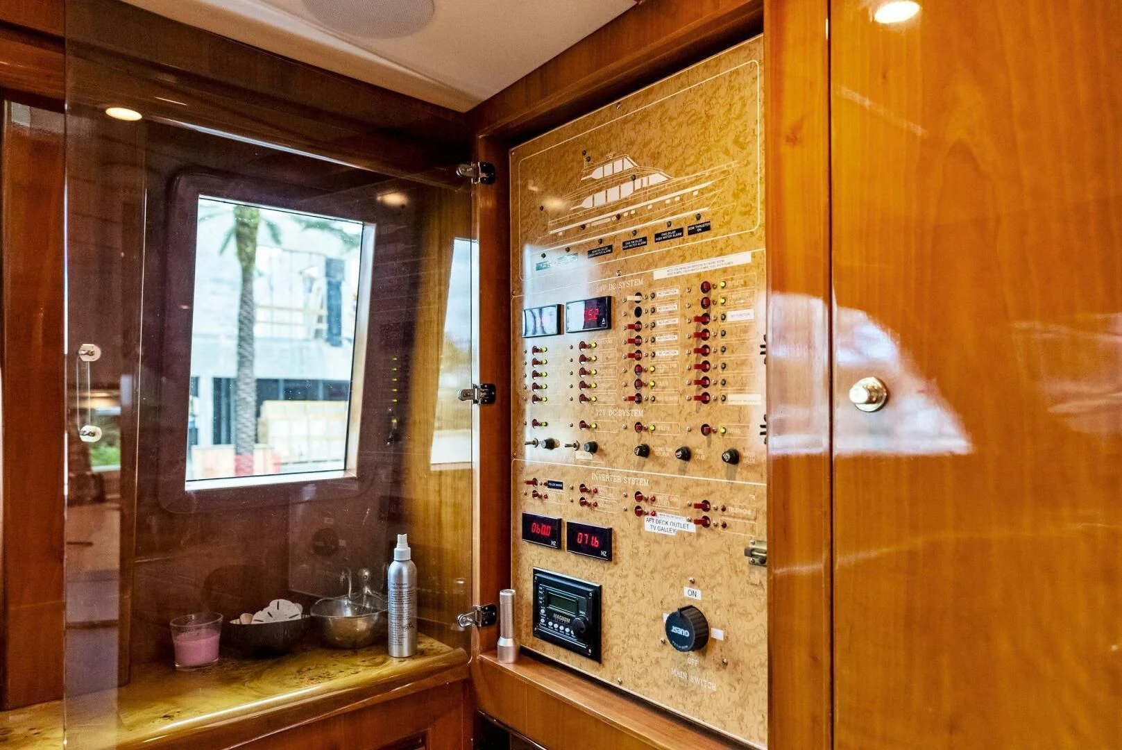 a wood cabinet with a screen aboard TORTUGA Yacht for Sale