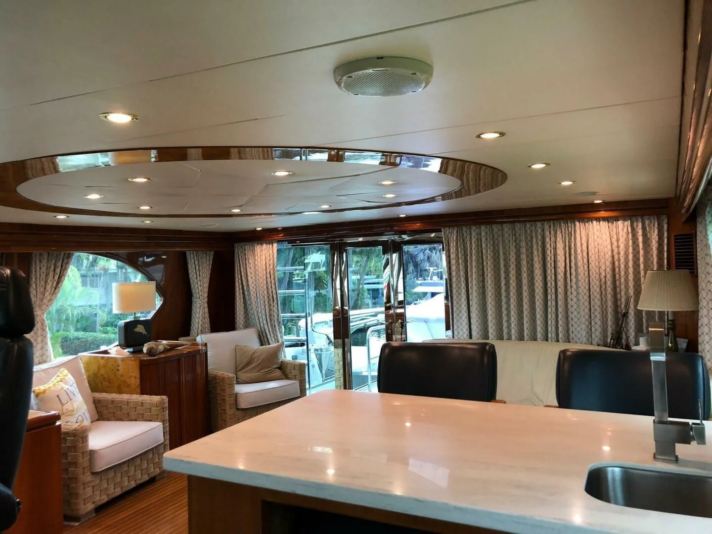 a large room with a table and chairs aboard TORTUGA Yacht for Sale