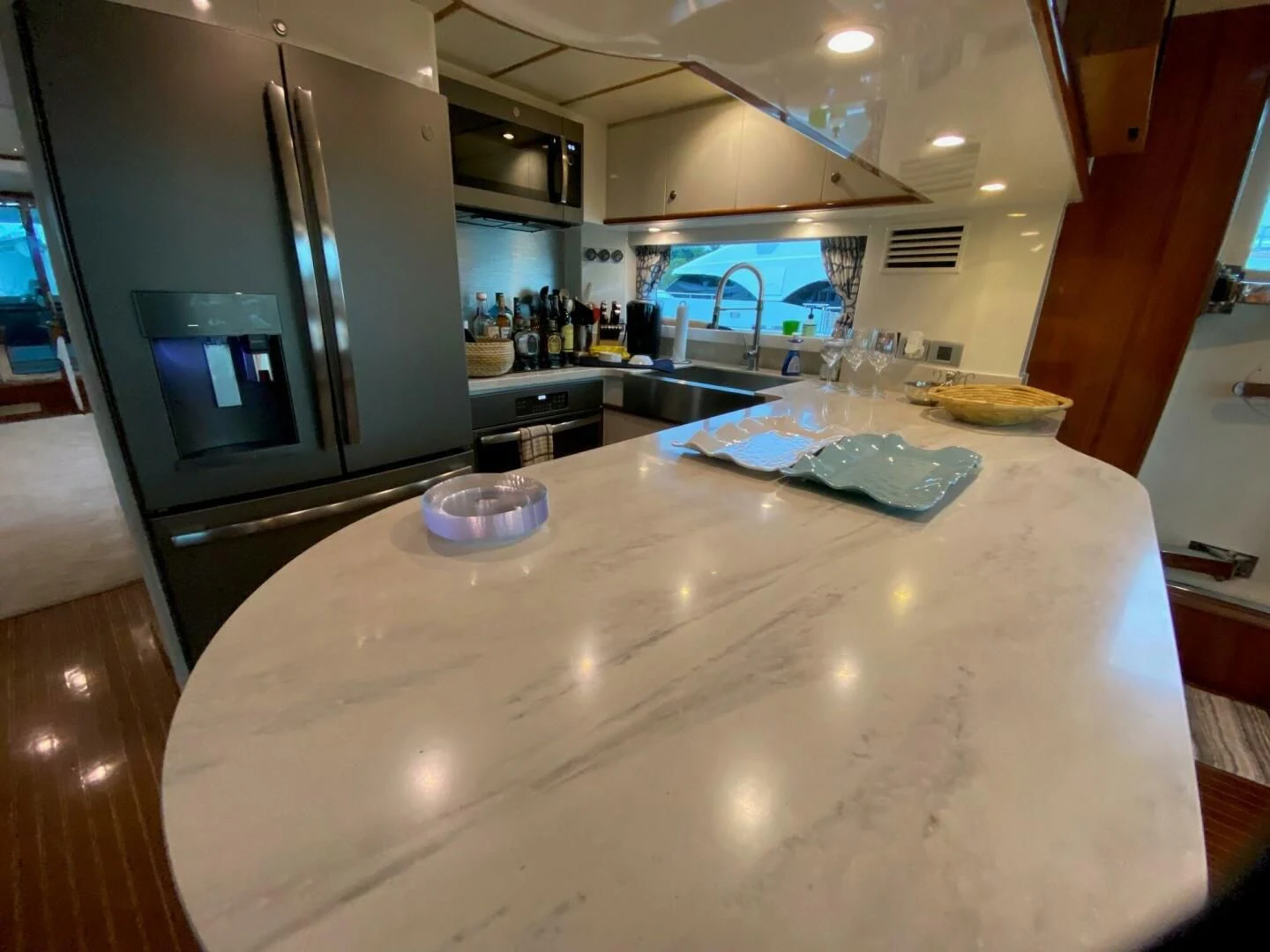 a kitchen with a large island aboard TORTUGA Yacht for Sale