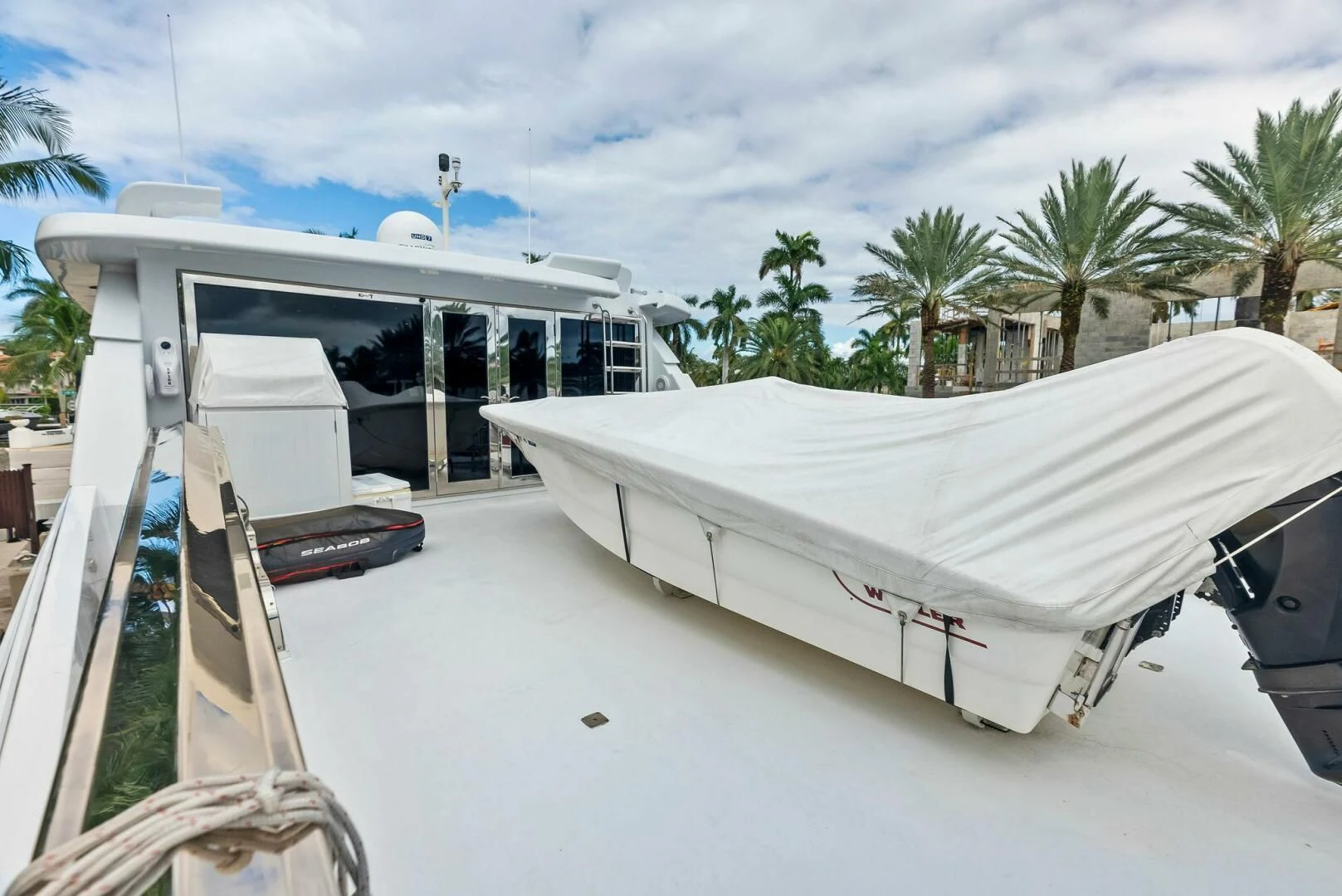 a white tent on a beach aboard TORTUGA Yacht for Sale