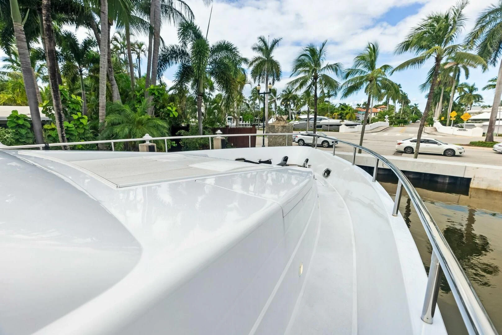 a swimming pool with a car parked on the side aboard TORTUGA Yacht for Sale