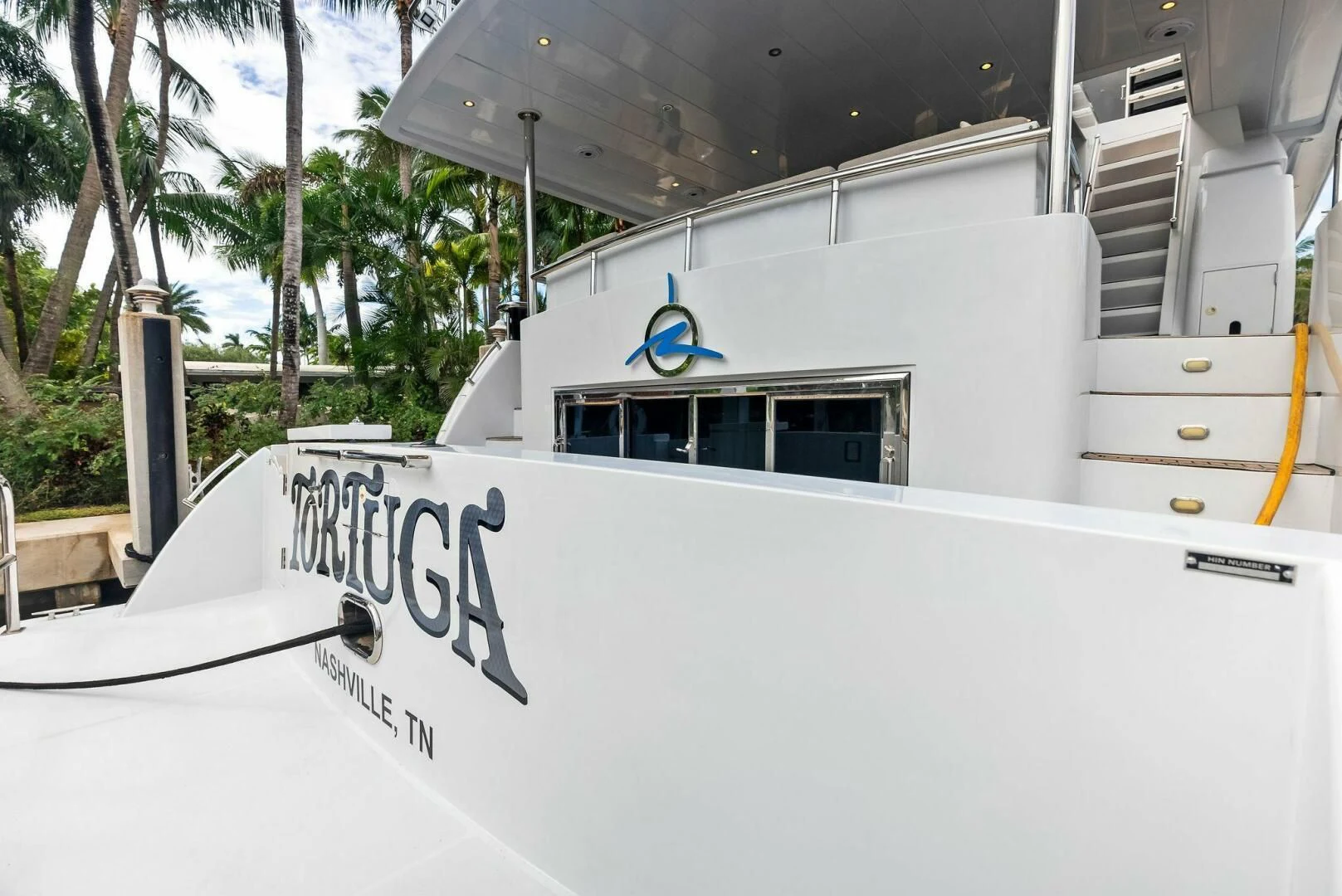 a white building with a sign on it aboard TORTUGA Yacht for Sale
