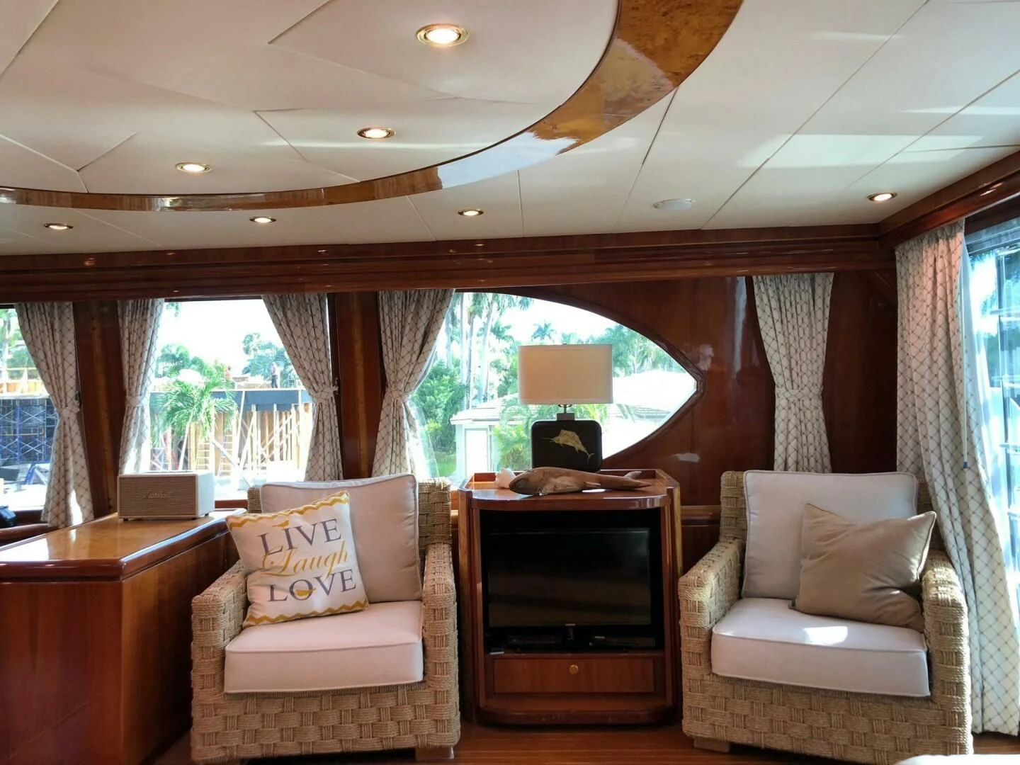 a living room with a fireplace aboard TORTUGA Yacht for Sale
