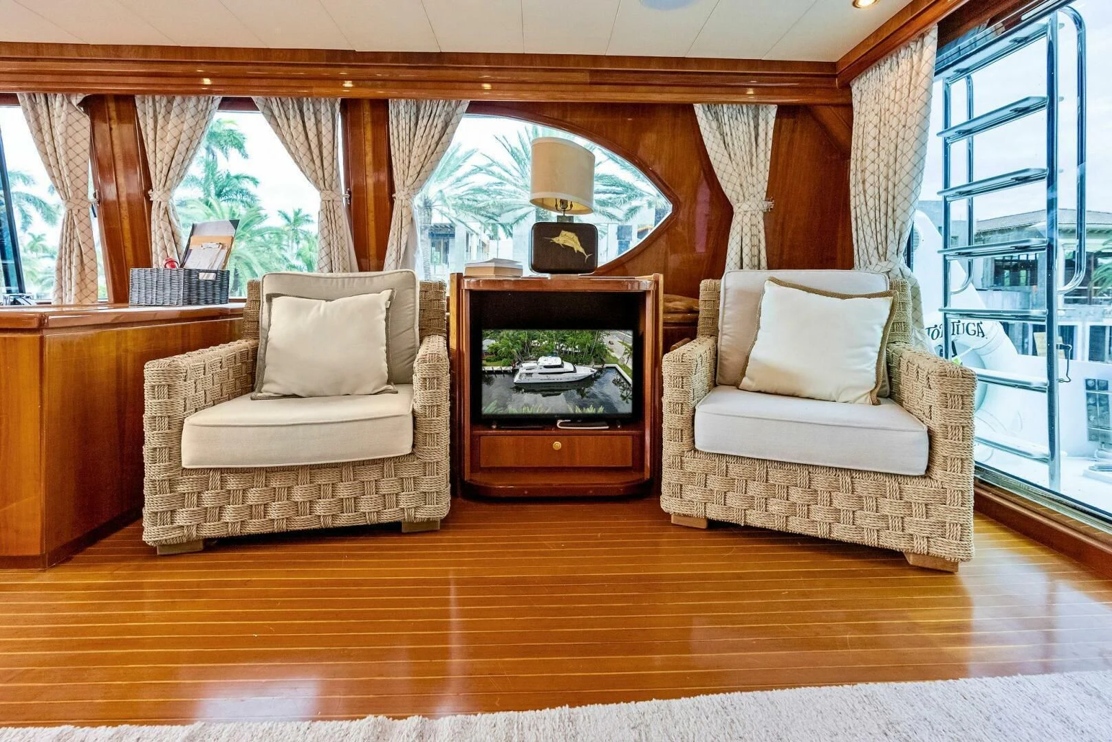a living room with a fireplace aboard TORTUGA Yacht for Sale