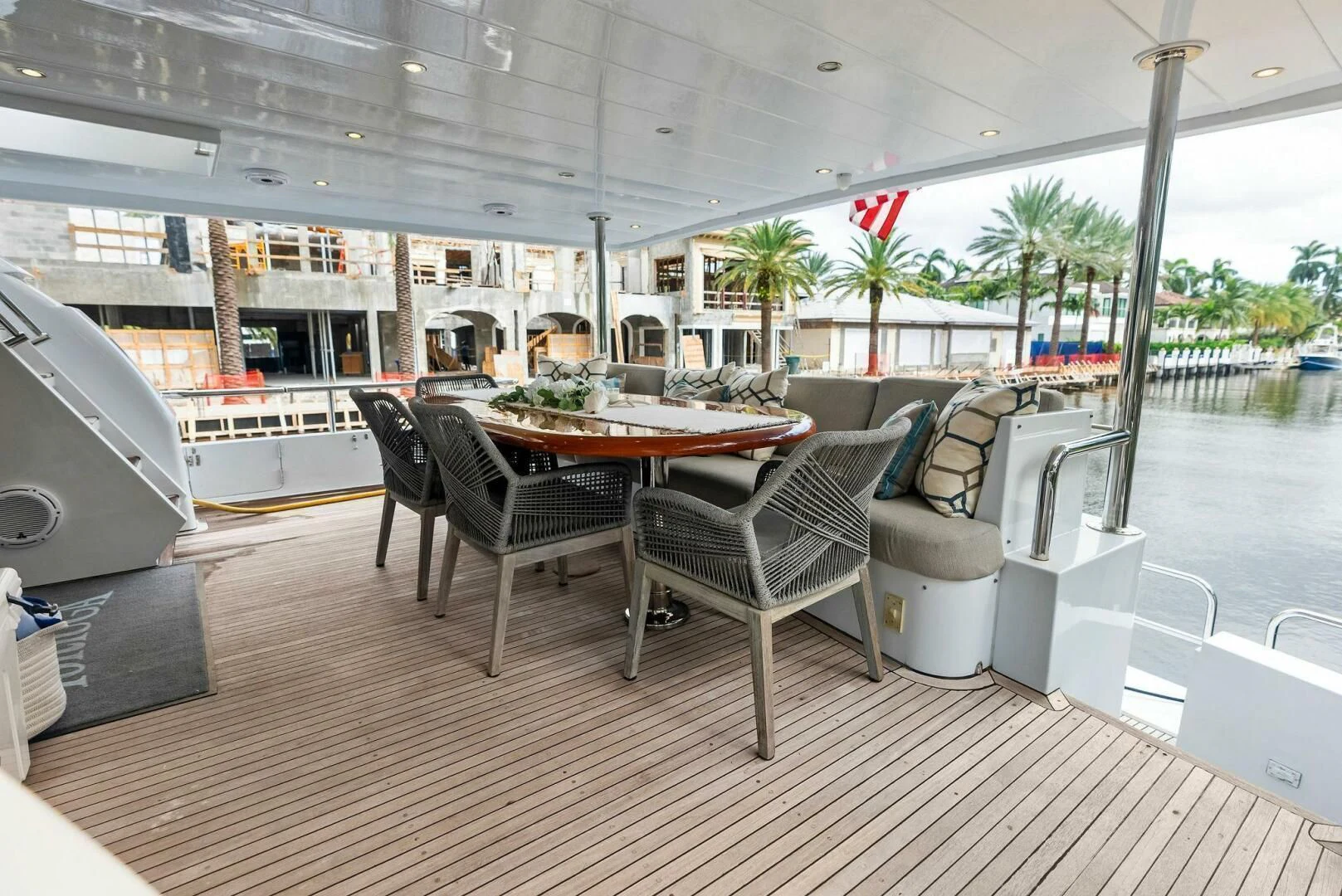 a table and chairs on a deck aboard TORTUGA Yacht for Sale