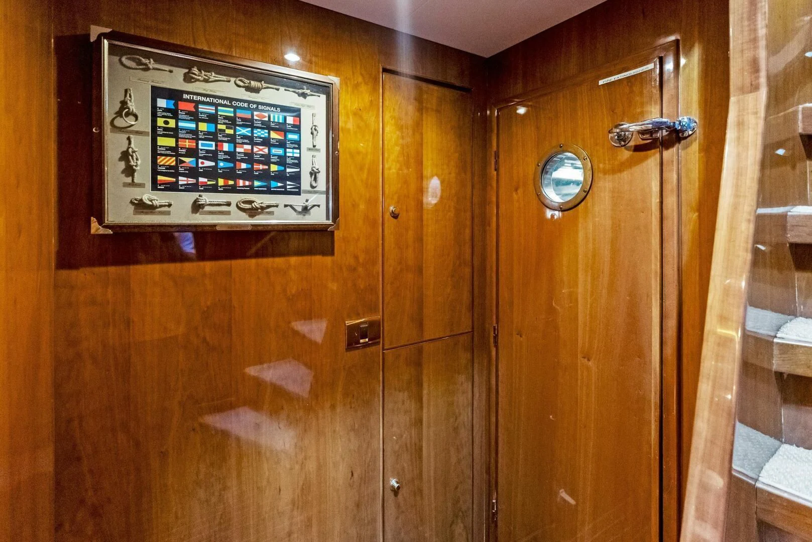 a computer on a wooden cabinet aboard TORTUGA Yacht for Sale