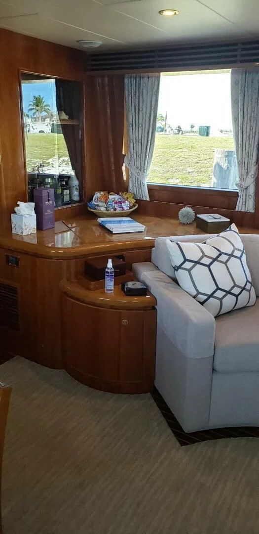 a living room with a desk and a couch aboard TORTUGA Yacht for Sale