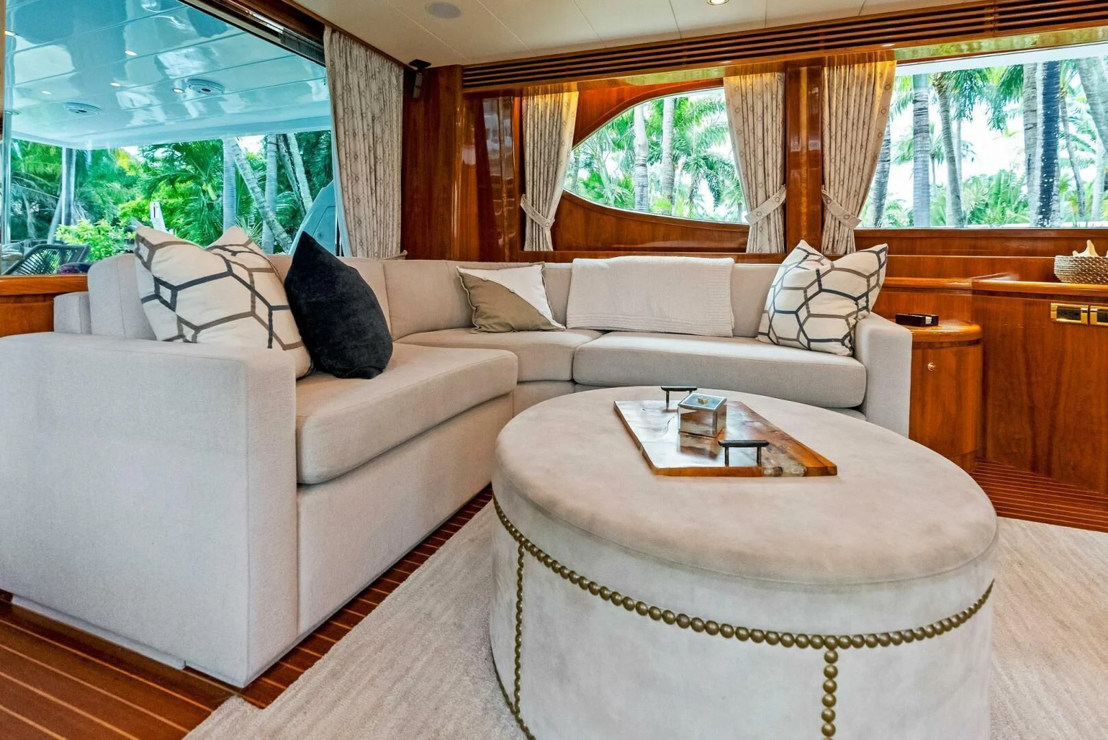 a living room with a couch and a table aboard TORTUGA Yacht for Sale