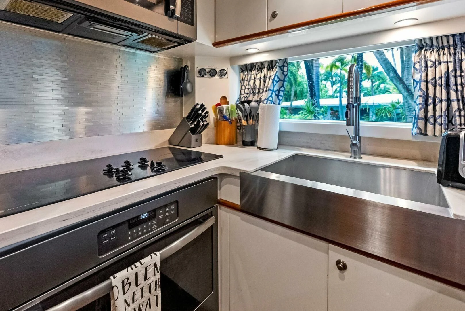 a kitchen with a stove and oven aboard TORTUGA Yacht for Sale