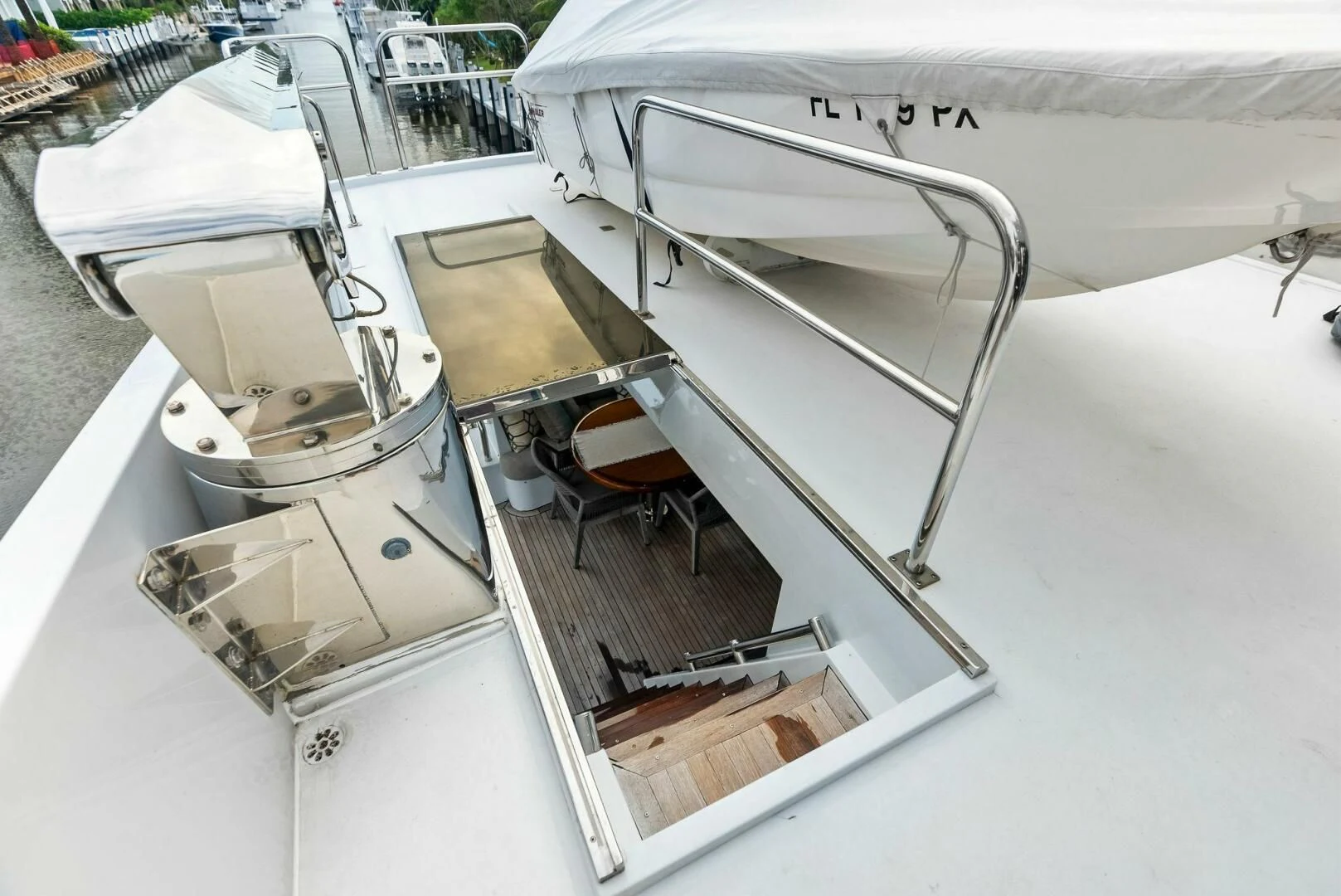 a boat with a sink and a chair on the deck aboard TORTUGA Yacht for Sale