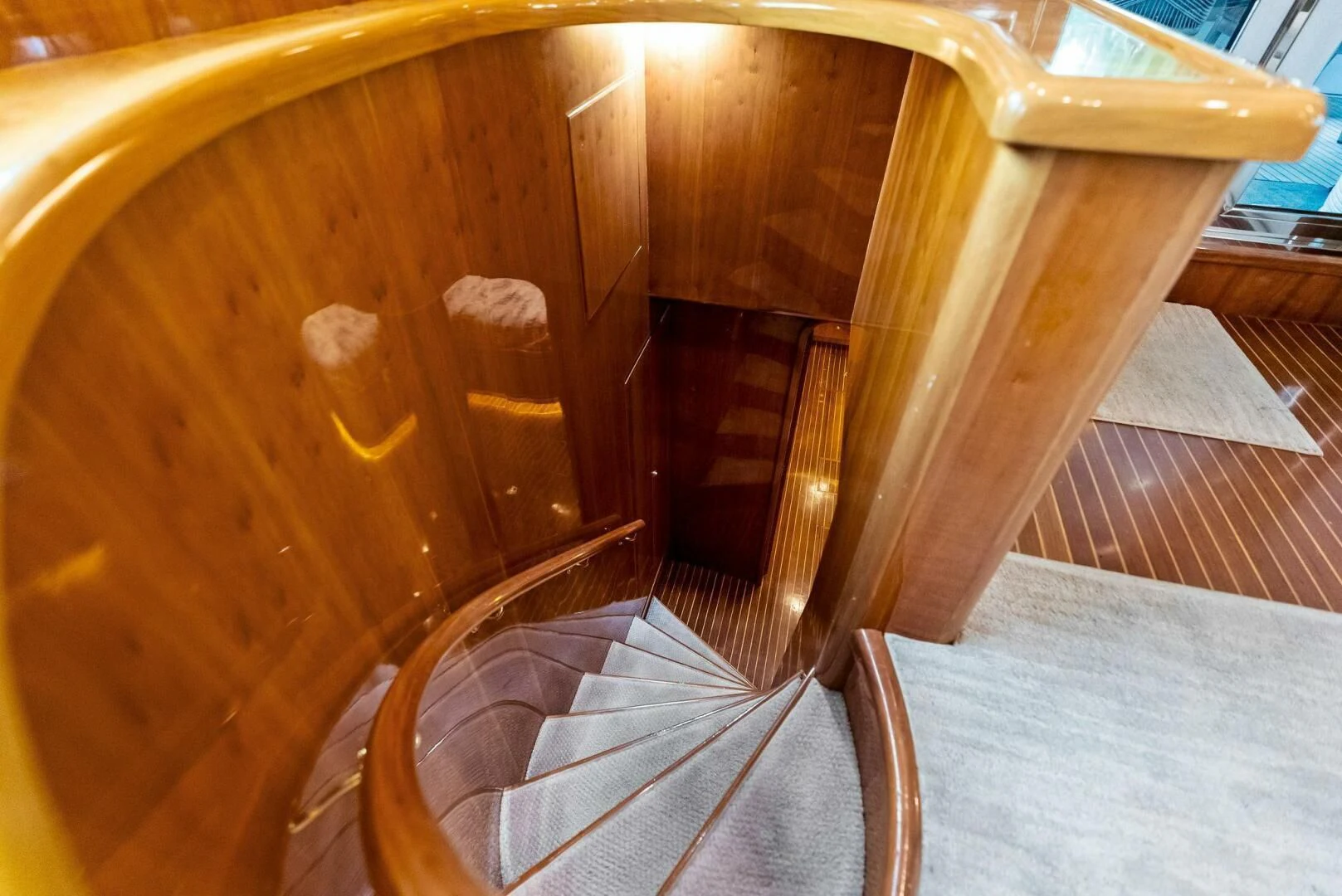 a wooden chair with a cushion aboard TORTUGA Yacht for Sale