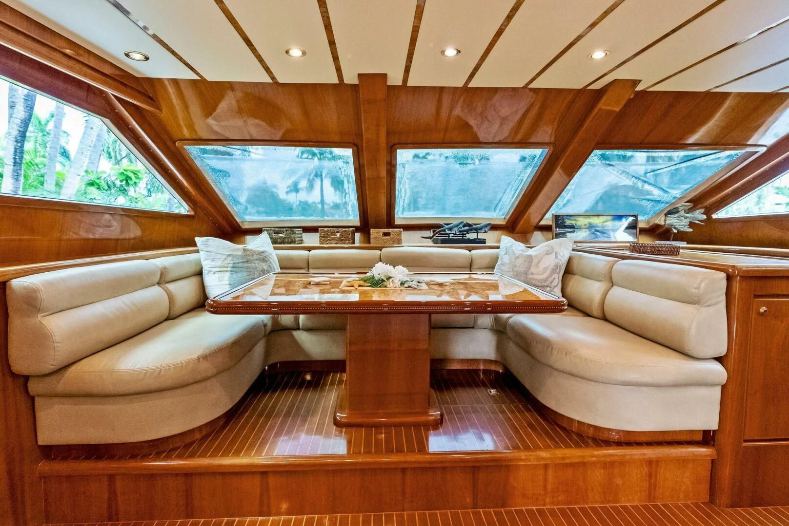 a living room with a large screen aboard TORTUGA Yacht for Sale