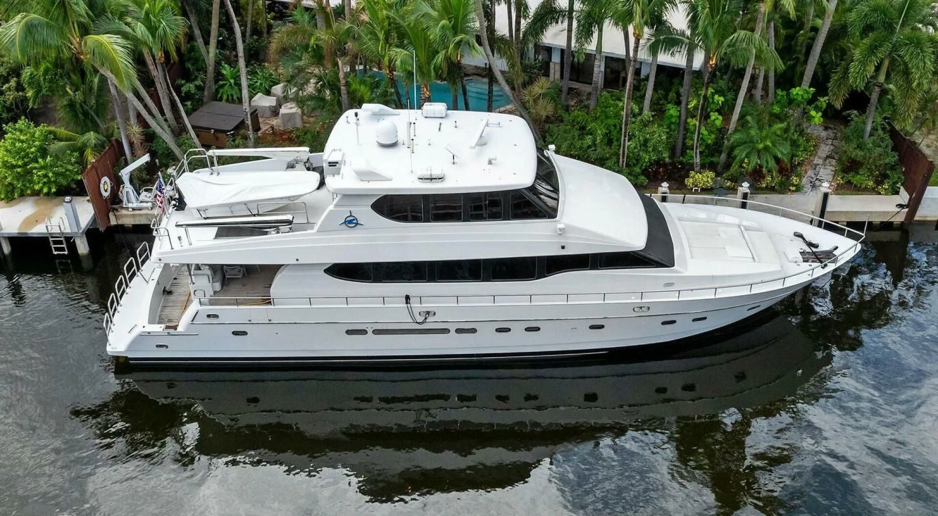 a white yacht in a tropical setting aboard TORTUGA Yacht for Sale