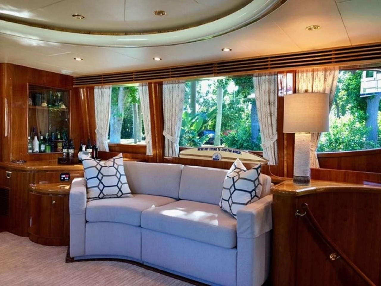 a living room with a couch and a window aboard TORTUGA Yacht for Sale