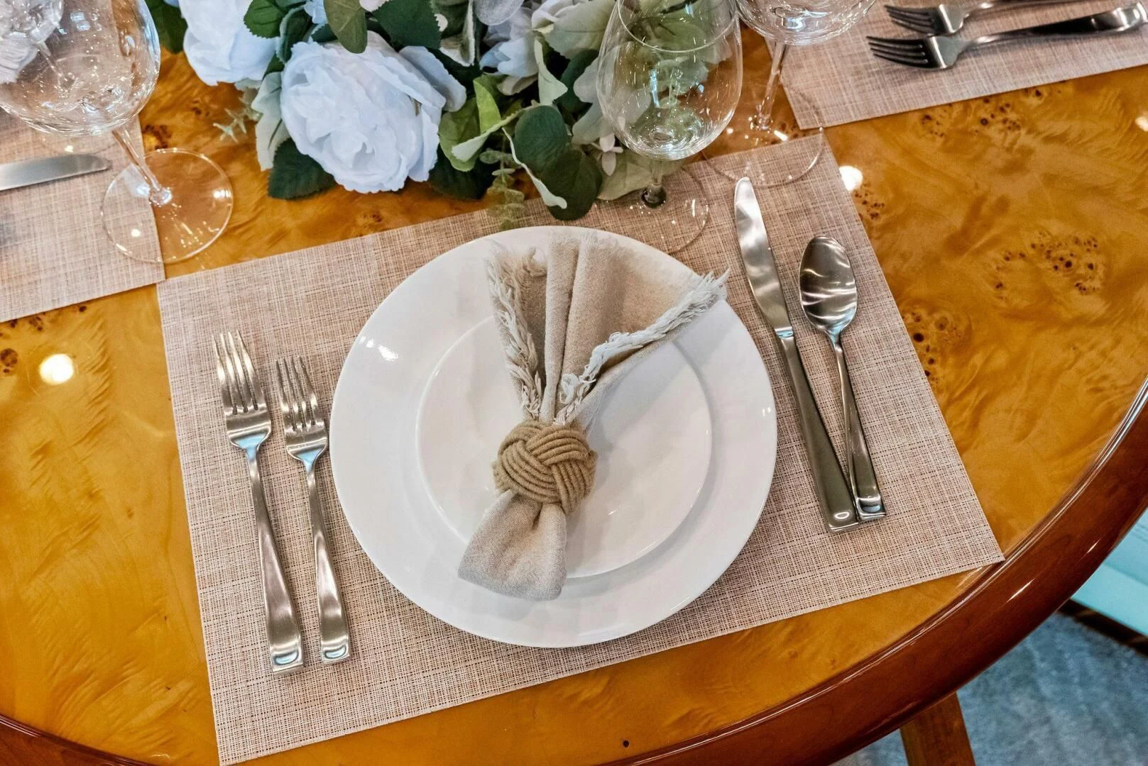 a table with silverware and silverware on it aboard TORTUGA Yacht for Sale