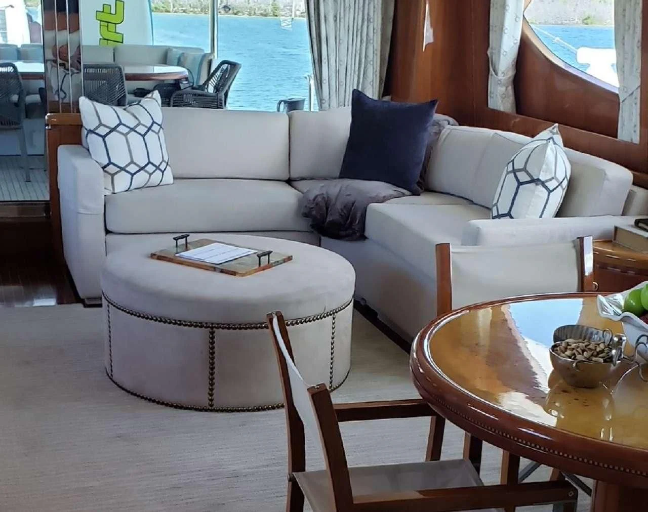 a couch and table in a room aboard TORTUGA Yacht for Sale